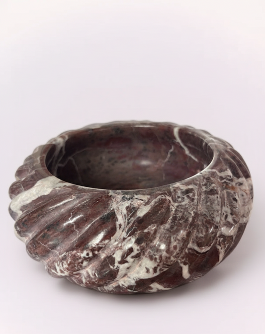 Inject some dramatic flair into your decor! This stunning, deeply veined marble bowl features rich burgundy and creamy white swirls, creating a mesmerizing 'amethyst' effect. Its unique, fluted shape adds a dynamic texture, making it perfect as a glamorous catch-all or a standout decorative piece.