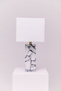 Standing at 25 inches tall, this stunning lamp features a robust stone body complemented by an iron finial, creating an exquisite statement piece for any room.