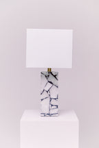 Standing at 25 inches tall, this stunning lamp features a robust stone body complemented by an iron finial, creating an exquisite statement piece for any room.