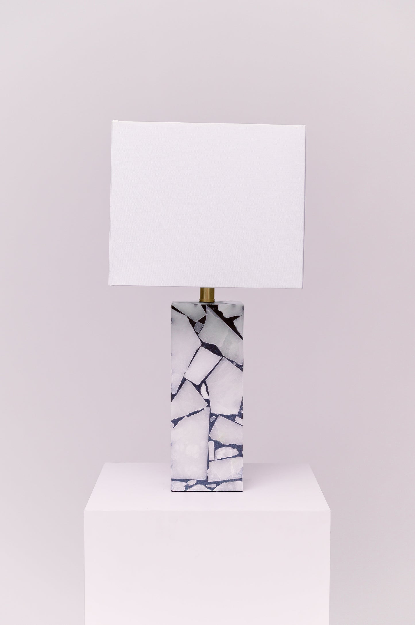 Standing at 25 inches tall, this stunning lamp features a robust stone body complemented by an iron finial, creating an exquisite statement piece for any room.
