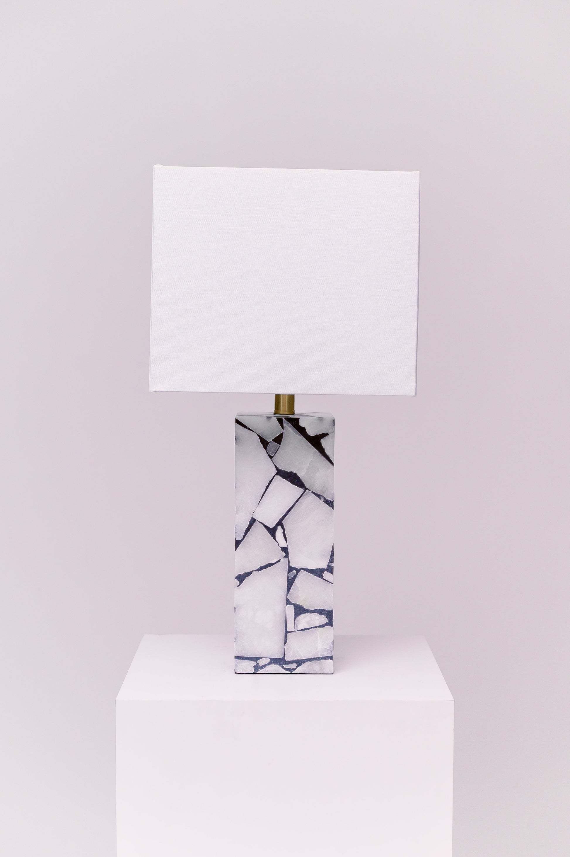 Standing at 25 inches tall, this stunning lamp features a robust stone body complemented by an iron finial, creating an exquisite statement piece for any room.