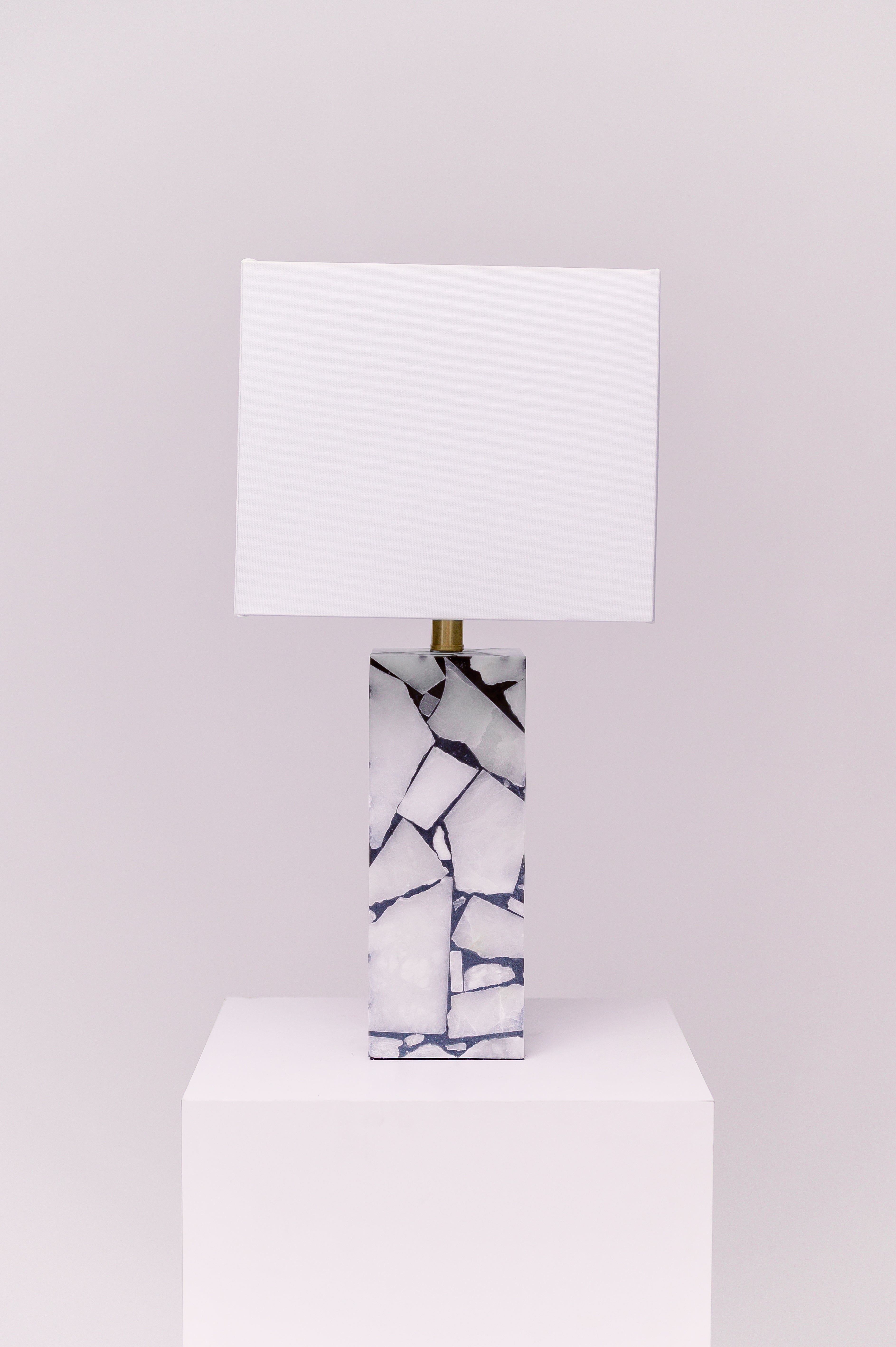 Standing at 25 inches tall, this stunning lamp features a robust stone body complemented by an iron finial, creating an exquisite statement piece for any room.