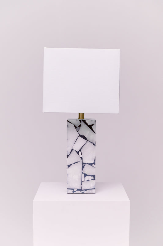 Standing at 25 inches tall, this stunning lamp features a robust stone body complemented by an iron finial, creating an exquisite statement piece for any room.