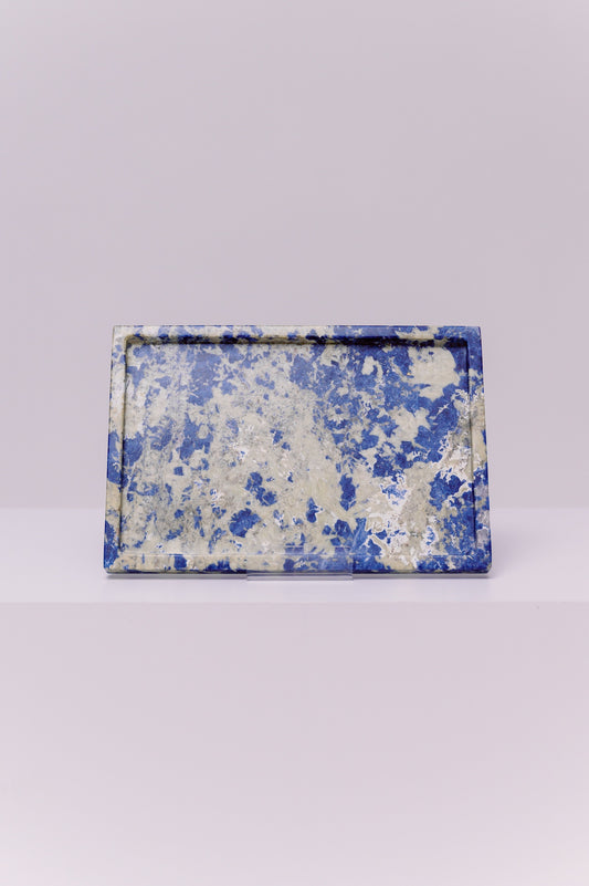 This exquisite, handcrafted piece of natural stone captures the soul of the ocean and the mystery of a starry night sky. The deep, royal blues swirl with clouds of ethereal white, creating a unique, captivating pattern that is as individual as you are. Each time you use this tray, whether to organize your cherished jewelry or to display your favorite perfumes, you'll be transported by its calming, grounding energy. 