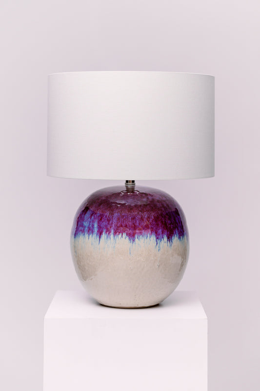 When heavy-hitting texture is desired, the Bessbrook Table Lamp brings it in spades. Made of ceramic with swirling and dripping patterns in a multi-colored reactive glaze. This artisanal piece was made by women artisans living at the border of Burma and Thailand. This lamp has been discontinued by Currey & Company.