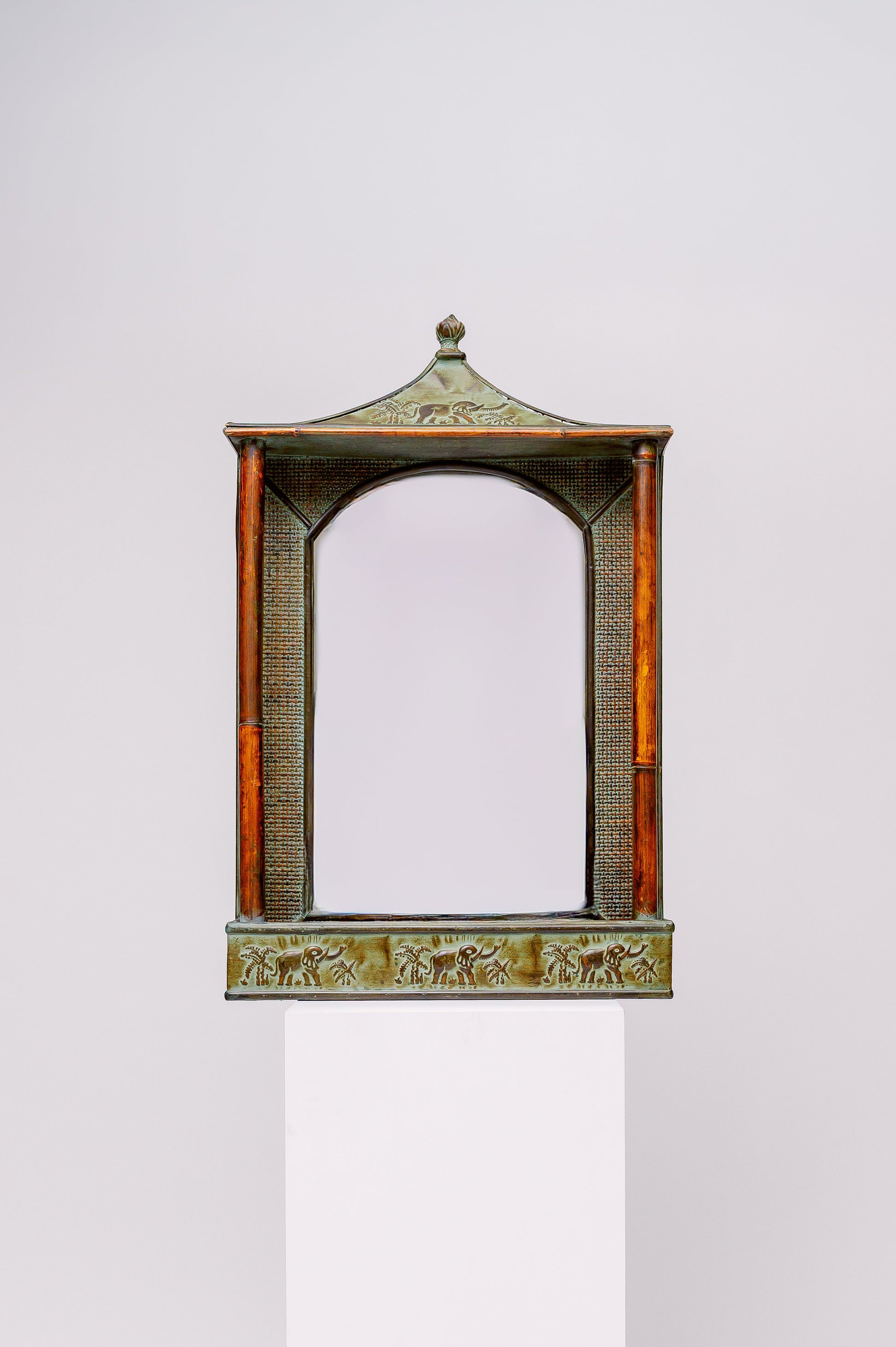 Vintage elephant pagoda mirror with bamboo and rattan details, and storage space in the bottom.