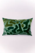 The Emerald Mosaic Lumbar is a textural masterpiece designed to elevate any space. Crafted from plush, shimmering emerald green velvet, this pillow features an intricate, tone-on-tone pattern created through detailed appliqué and stitching. The varying shades of green, from dark jade to bright teal, and the mix of soft velvet with a more structured, stitched fabric, create a rich, three-dimensional effect. Its elongated shape is ideal for providing stylish support and a designer finish to armchairs, benches