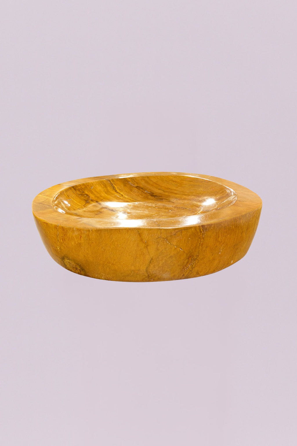 Elevate your space with this one-of-a-kind marble bowl, featuring rich golden tones and natural veining that make each piece truly unique. Crafted from solid marble, this sculptural bowl blends organic texture with a polished finish, creating a striking balance between earthy and refined.