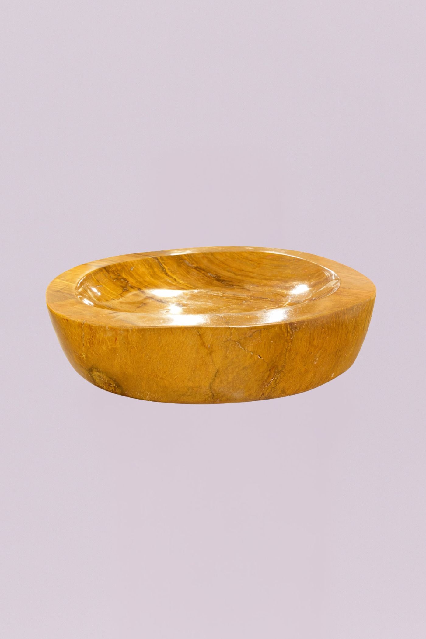 Elevate your space with this one-of-a-kind marble bowl, featuring rich golden tones and natural veining that make each piece truly unique. Crafted from solid marble, this sculptural bowl blends organic texture with a polished finish, creating a striking balance between earthy and refined.