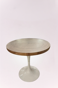 Round bistro table featuring a solid wood top with concentric design and a sleek white pedestal base