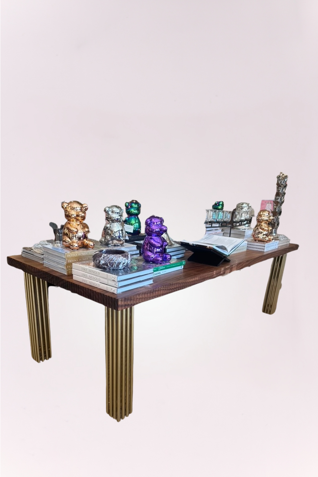 Handmade dining table, featuring a rich wood top with intricate carved detailing and elegant brass legs. 