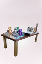 Handmade dining table, featuring a rich wood top with intricate carved detailing and elegant brass legs. 