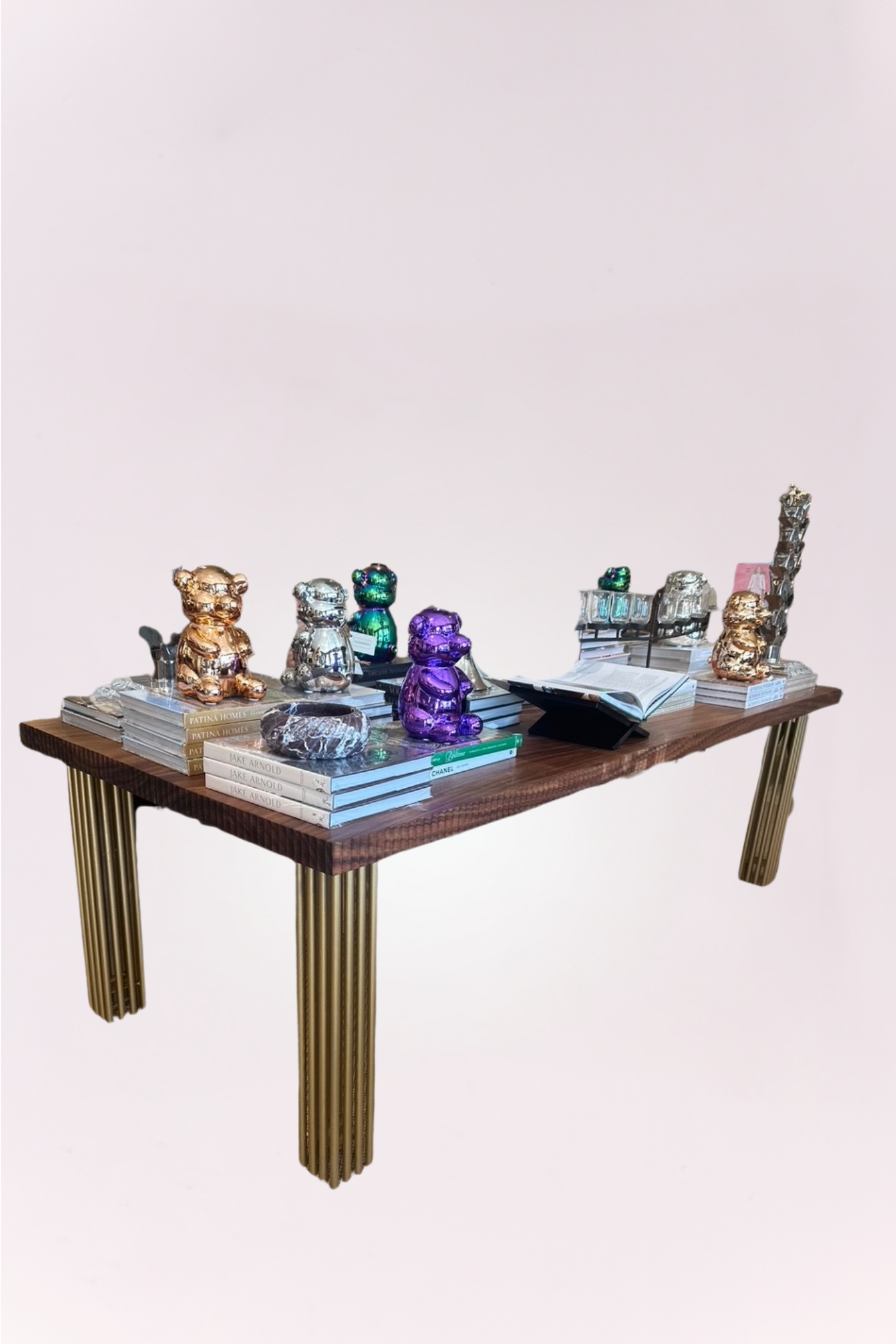 Handmade dining table, featuring a rich wood top with intricate carved detailing and elegant brass legs. 