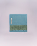 Hand-loomed from pure baby alpaca, it is soft, luminous, and effortlessly refined.