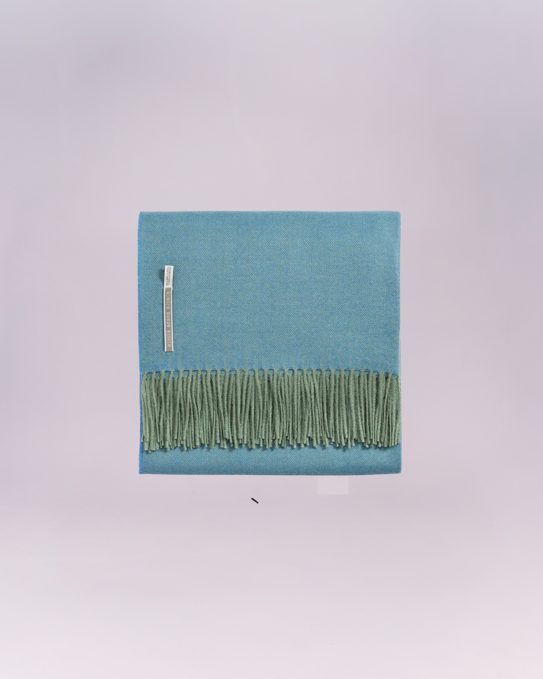 Hand-loomed from pure baby alpaca, it is soft, luminous, and effortlessly refined.