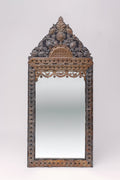 Translating to "the ancient vine", this large tin adorned mirror features intricate carvings of florals, animals and geometric shapes.