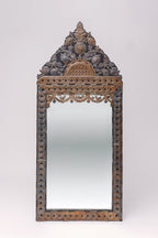 Translating to "the ancient vine", this large tin adorned mirror features intricate carvings of florals, animals and geometric shapes.
