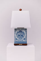 Ralph Lauren blue and white ceramic table lamp mounted on a walnut base with koi fish on both sides.