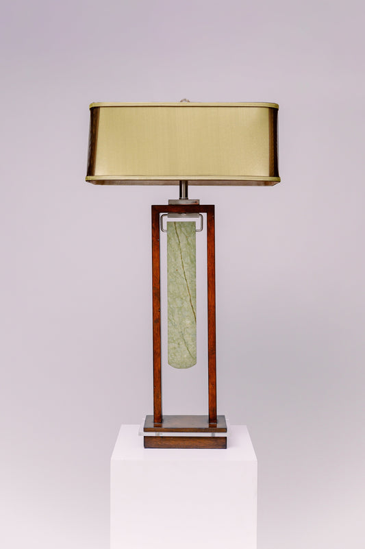 Two light table lamp - rectangular mahogany finished frame with clear lucite accent and a blade shaped piece of green jade stone suspended at the center like a pendulum.