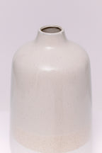 This minimalist stoneware vase features a clean cylindrical form with a soft taper at the neck. The body is finished in a natural two-tone glaze: a speckled white base, warm beige midsection, and soft taupe upper body, creating a subtle gradient effect. The matte texture and earthy palette lend a modern organic look, ideal for contemporary interiors.