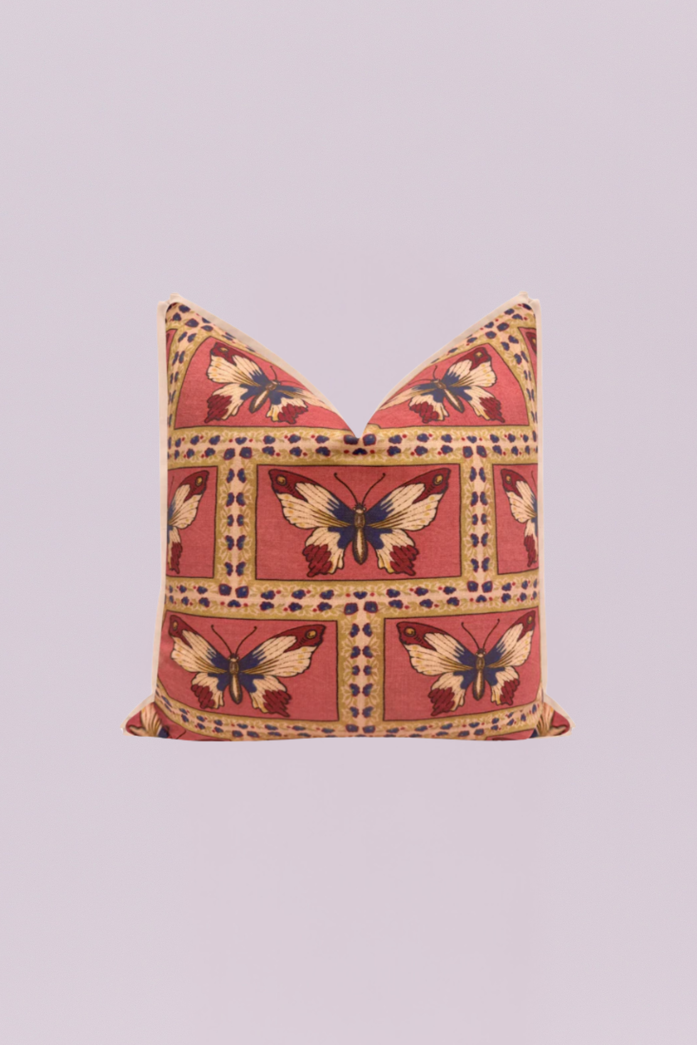 A beautifully rendered traditional-style pillow featuring repeating, framed motifs of majestic butterflies in deep red, navy blue, and cream on a rich, dusty rose background. The design is finished with a neutral, tailored flange edge, evoking an air of classic, vintage charm.