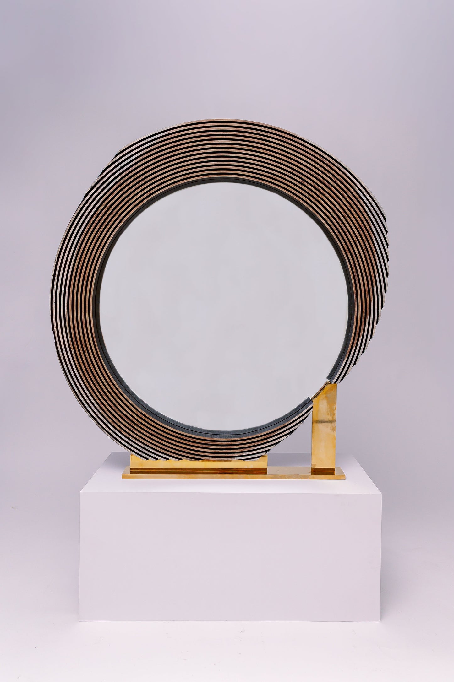 This one-of-a-kind custom wood mirror is a sculptural, statement piece with a bold and modern design.