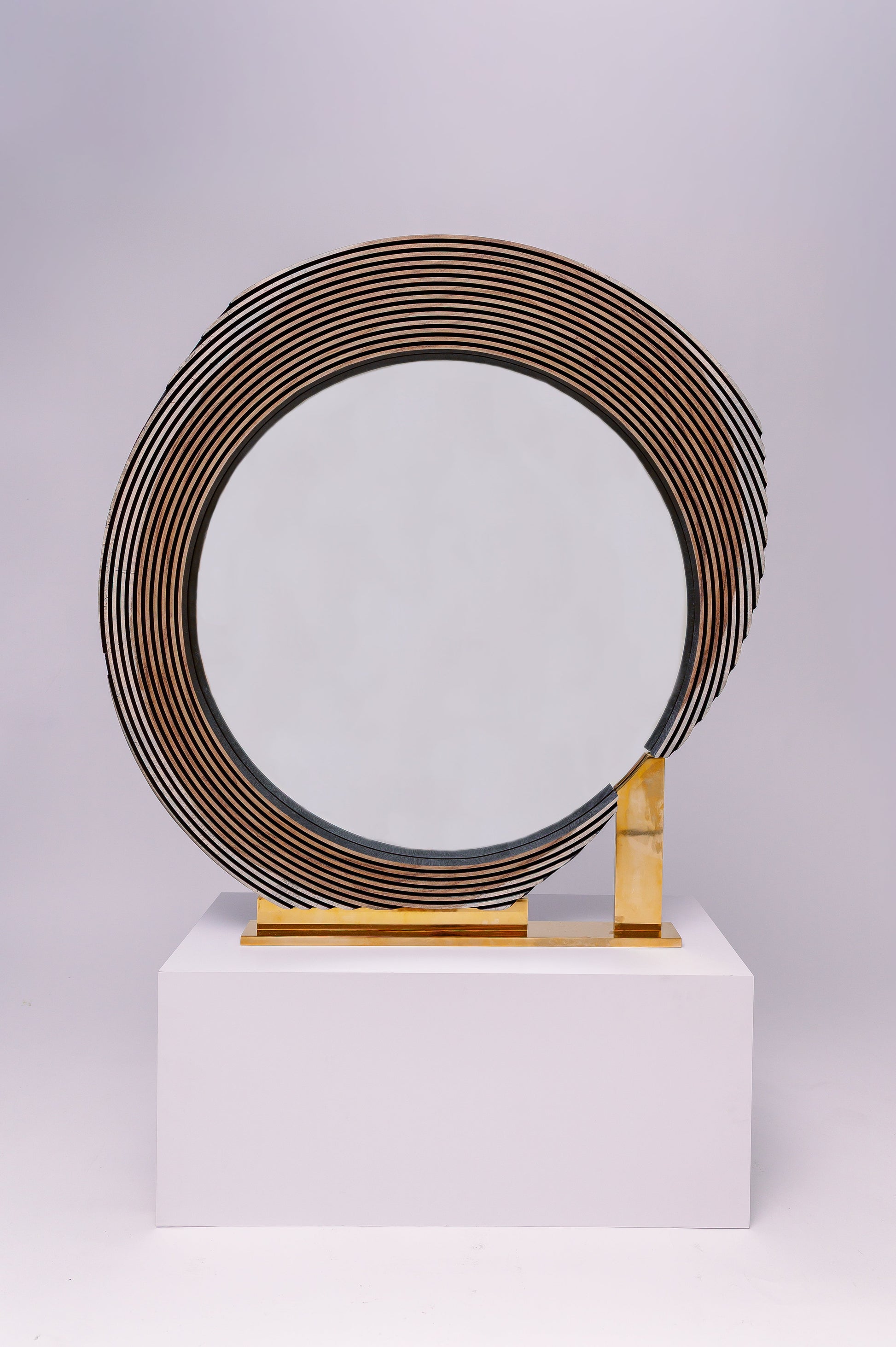 This one-of-a-kind custom wood mirror is a sculptural, statement piece with a bold and modern design.