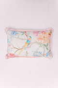 Showcasing a pastel scene of a colorful bird perched among sprawling blossoms and branches, the subtle, watercolor-effect print is rendered in soft hues of sky blue, gentle peach, and muted green against a light, woven background. A whimsical pink ruffled edge beautifully frames the design, adding a layer of vintage charm and feminine elegance. This lumbar pillow is the perfect accent to bring softness and nostalgic beauty to a bedroom, window seat, or shabby-chic living space.