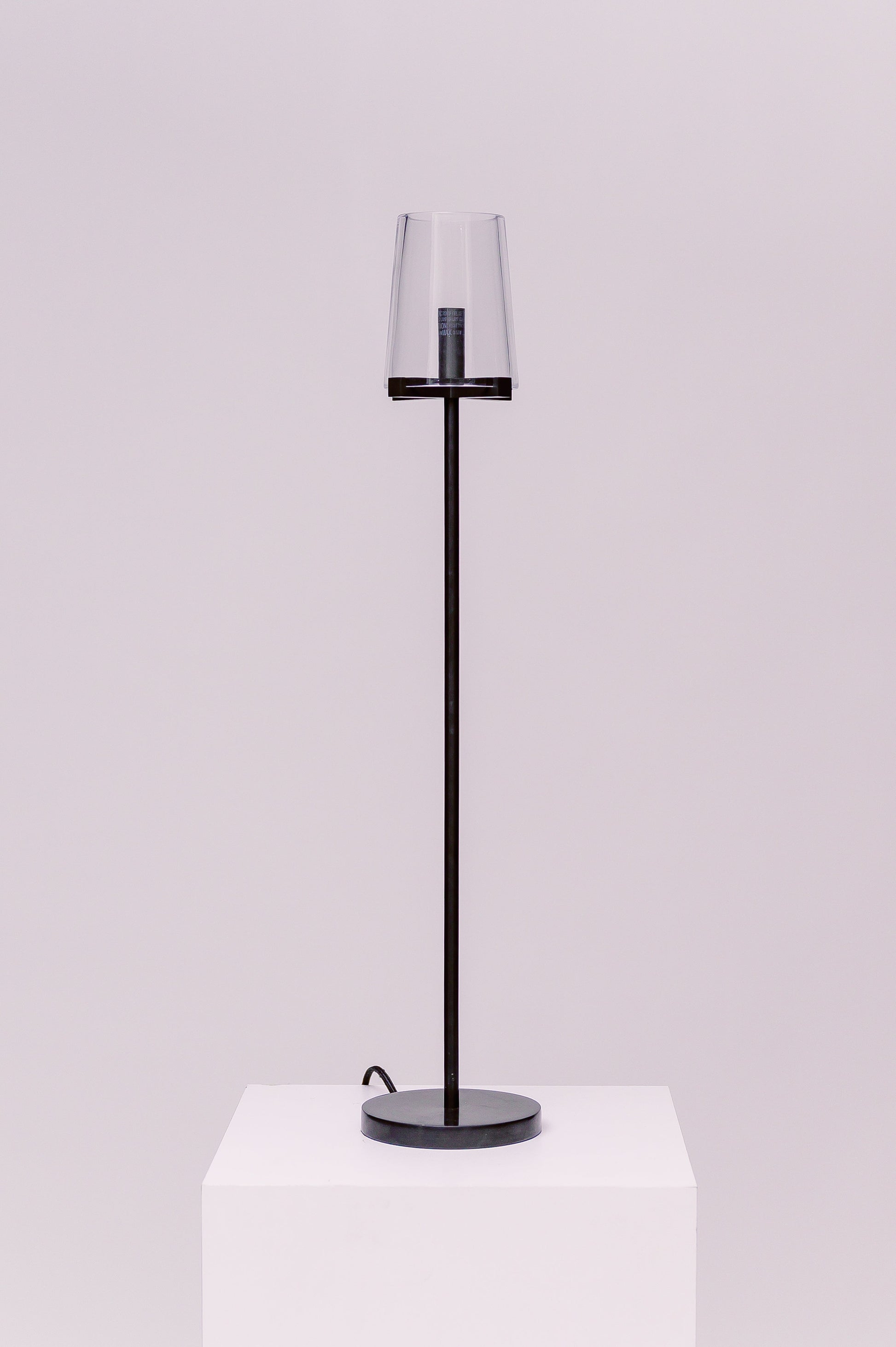 Created by renowned lighting designer Jonathan Browning, this table lamp distills the hurricane lamp to its essence. Inspired by French fixtures of the 1940s, its hand-blown shades are a traditional tapered shape, while the solid brass frame offers a modern counterpoint.