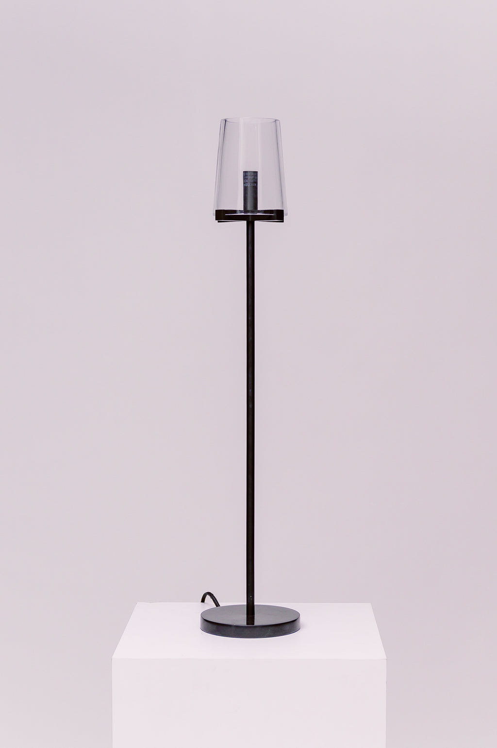 Created by renowned lighting designer Jonathan Browning, this table lamp distills the hurricane lamp to its essence. Inspired by French fixtures of the 1940s, its hand-blown shades are a traditional tapered shape, while the solid brass frame offers a modern counterpoint.