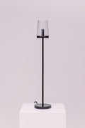 Created by renowned lighting designer Jonathan Browning, this table lamp distills the hurricane lamp to its essence. Inspired by French fixtures of the 1940s, its hand-blown shades are a traditional tapered shape, while the solid brass frame offers a modern counterpoint.