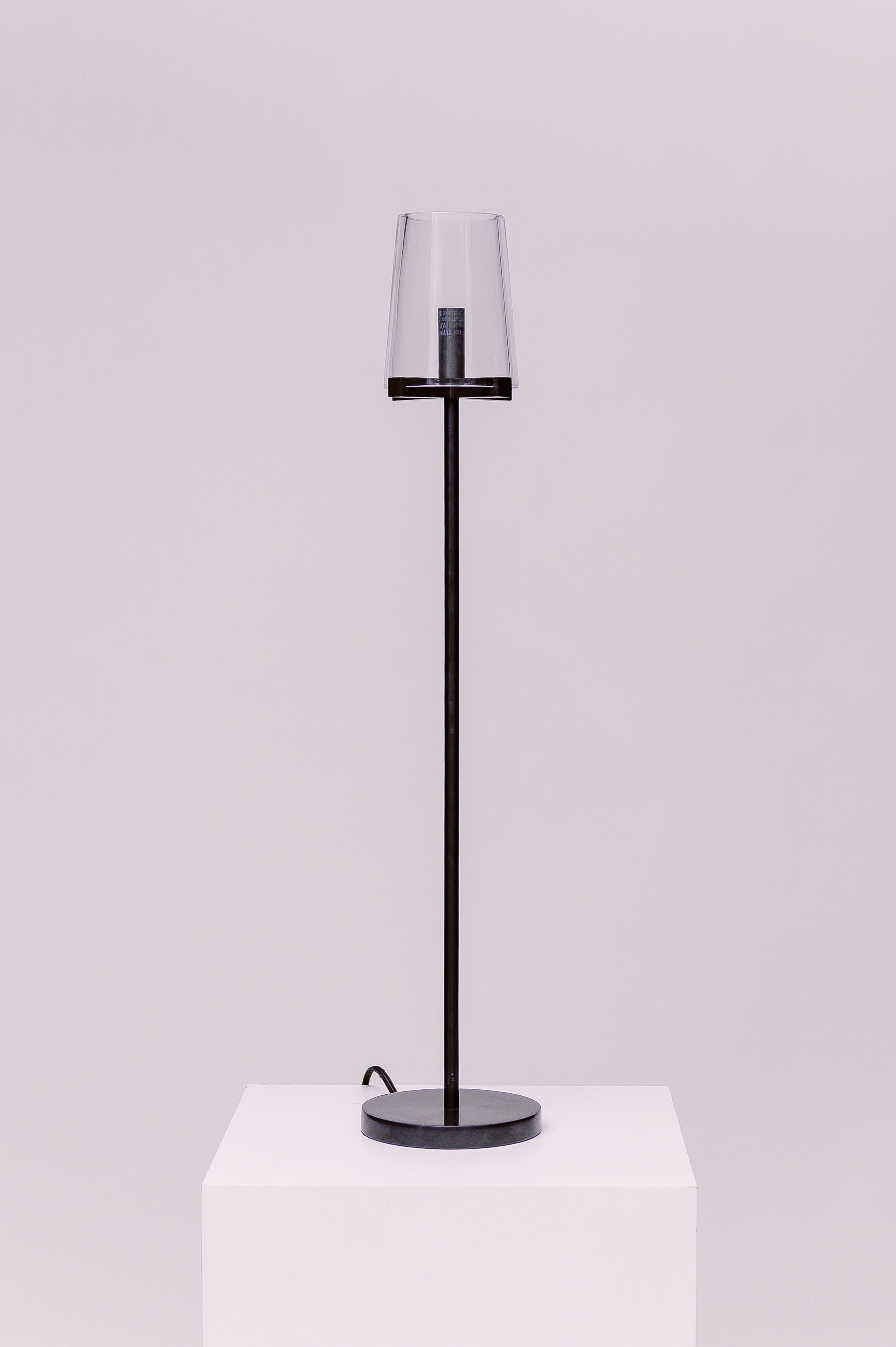 Created by renowned lighting designer Jonathan Browning, this table lamp distills the hurricane lamp to its essence. Inspired by French fixtures of the 1940s, its hand-blown shades are a traditional tapered shape, while the solid brass frame offers a modern counterpoint.