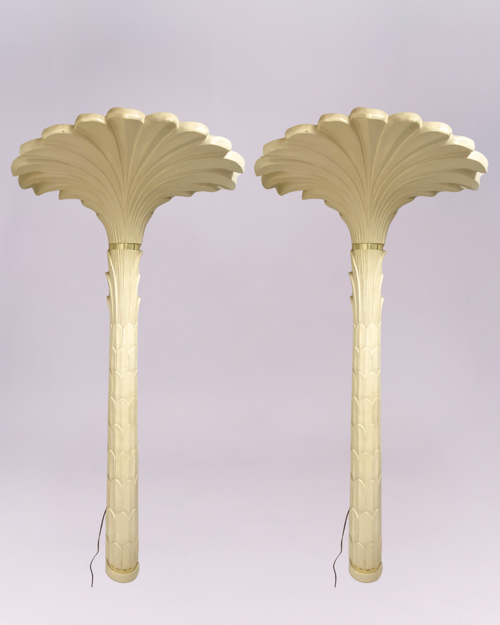 Channel the iconic glamour of French designer Serge Roche with this breathtaking pair of vintage palm tree torchere floor lamps. Each lamp is a dramatic sculptural statement, expertly crafted from molded resin with a creamy, plaster-like finish that captures the Neoclassical elegance of the Art Deco era. $3,500.00each