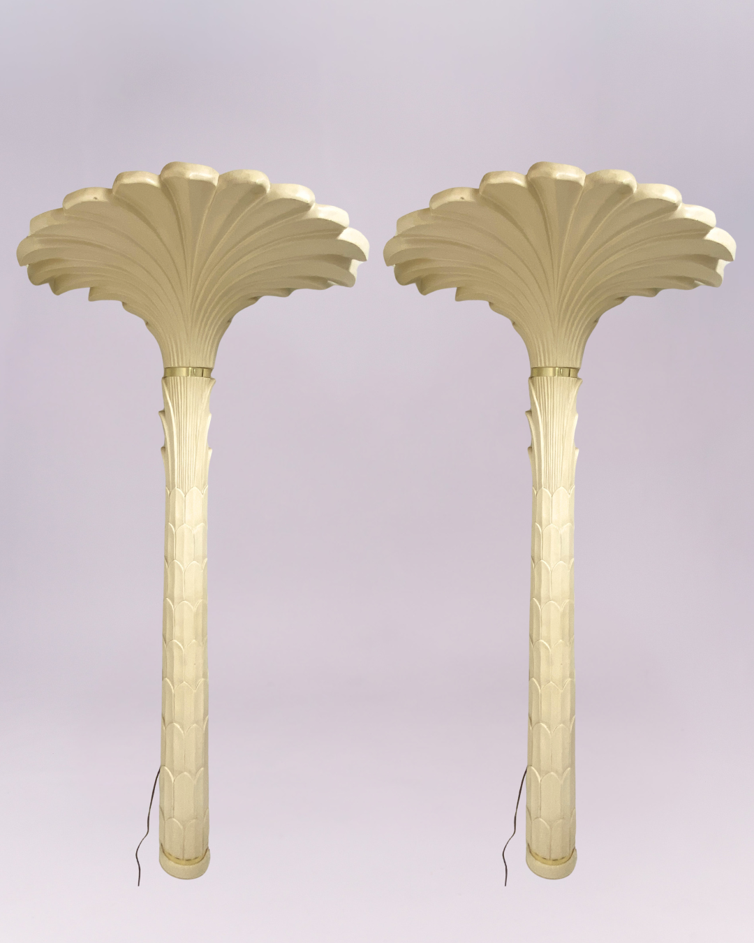 Channel the iconic glamour of French designer Serge Roche with this breathtaking pair of vintage palm tree torchere floor lamps. Each lamp is a dramatic sculptural statement, expertly crafted from molded resin with a creamy, plaster-like finish that captures the Neoclassical elegance of the Art Deco era. $3,500.00each