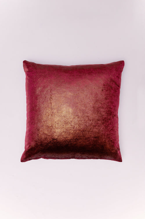Indulge in the opulent texture and luminous glow of The Ruby Ember Pillow. Crafted from ultra-plush crushed velvet in a deep, vibrant ruby red, this piece is dramatically enhanced by a shimmering gold wash. This unique finish catches the light, creating a dynamic, two-toned effect—like a fire burning under the velvet pile. It's the ultimate accent for adding decadent, jewel-toned glamour and warmth to a sophisticated living room or master bedroom.