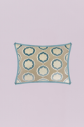 This elegant rectangular pillow features a plush, woven geometric ogee pattern in shades of soft blue and ivory on a warm taupe background. The design is neatly framed by a bold, tailored light blue piping, offering a chic global and contemporary feel.