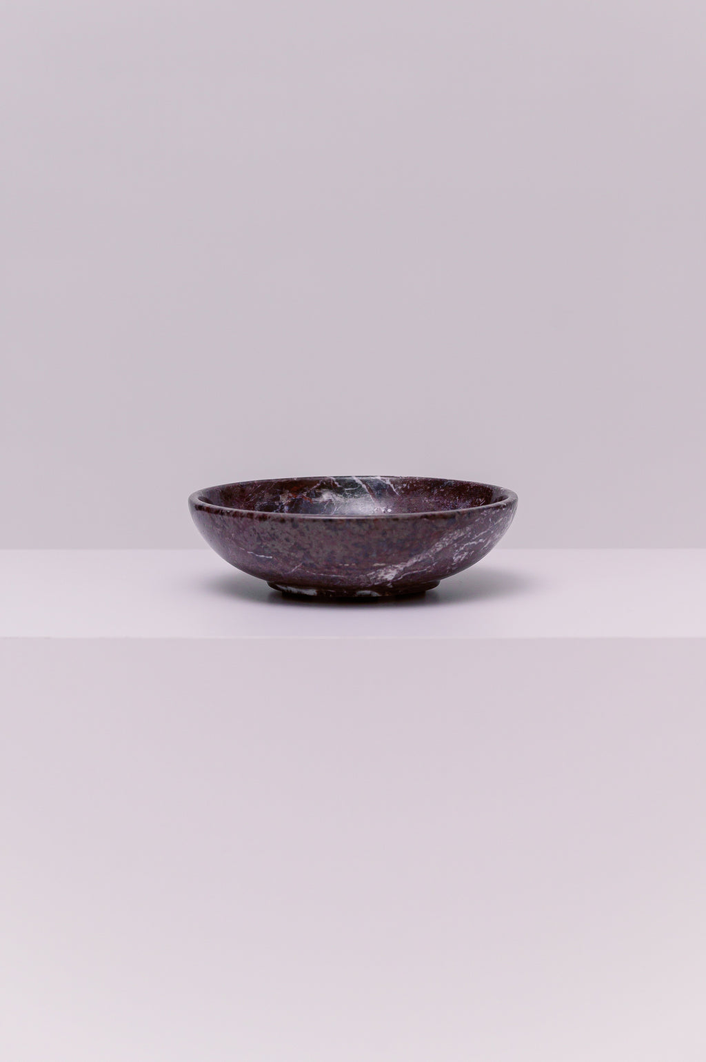 A stunning marble bowl, perfect to hold your favorite small accessories.