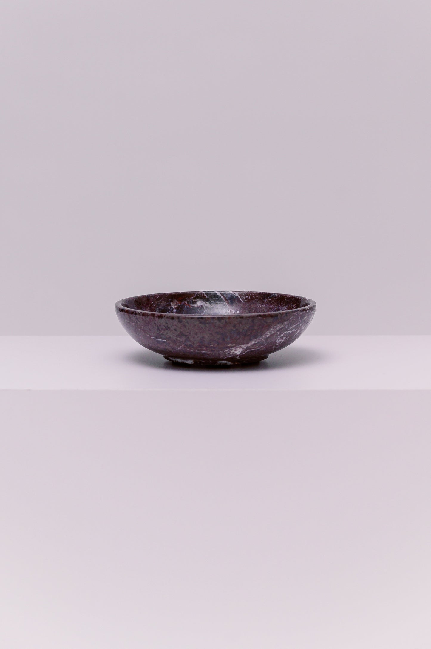A stunning marble bowl, perfect to hold your favorite small accessories.