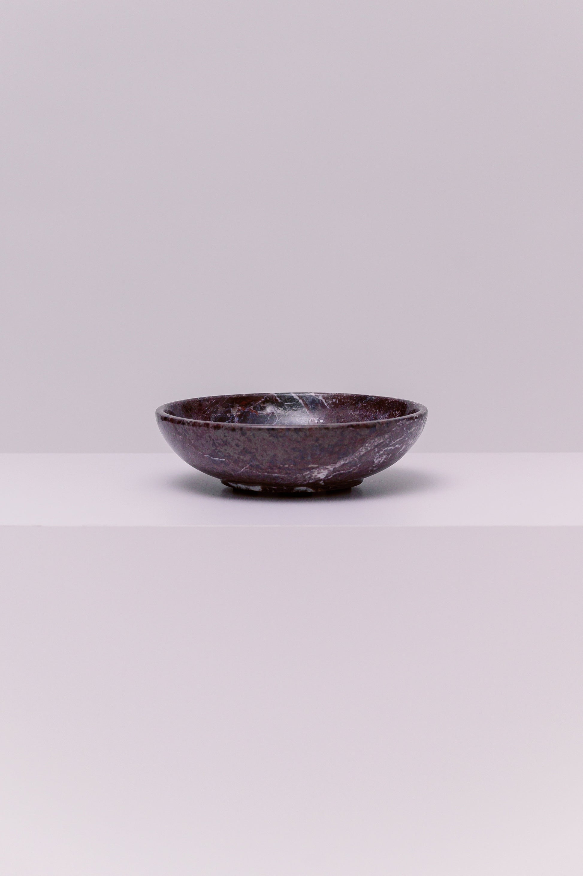 A stunning marble bowl, perfect to hold your favorite small accessories.