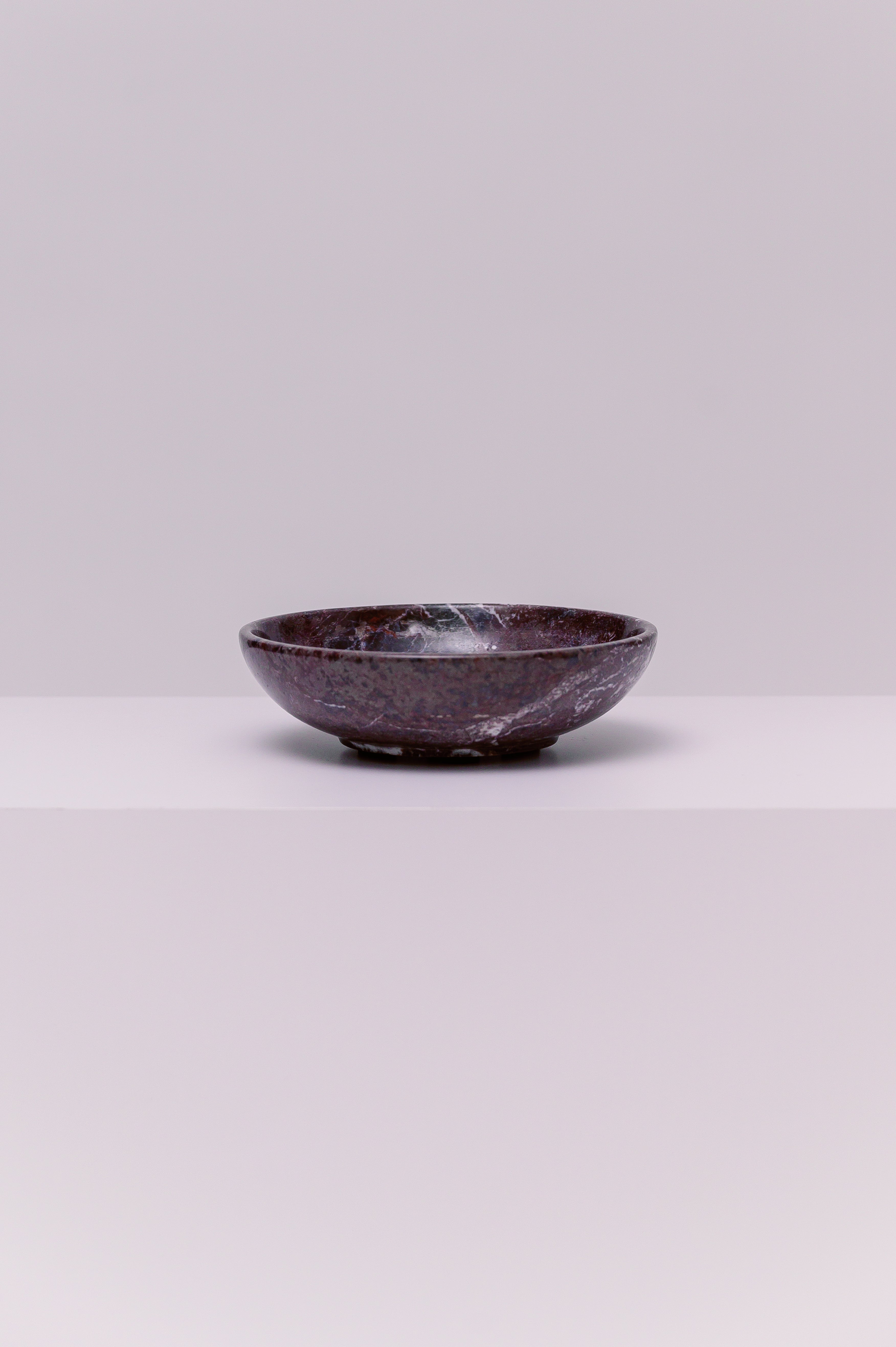 A stunning marble bowl, perfect to hold your favorite small accessories.