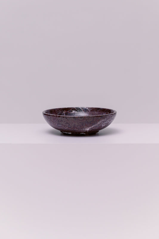 A stunning marble bowl, perfect to hold your favorite small accessories.