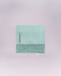 Hand-loomed from pure baby alpaca, it is soft, luminous, and effortlessly refined.
