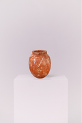 Crafted from genuine stone, this vase showcases the raw beauty of earth-toned marble. The heavy, high-quality feel provides a perfect contrast to its smooth, elegant shape.