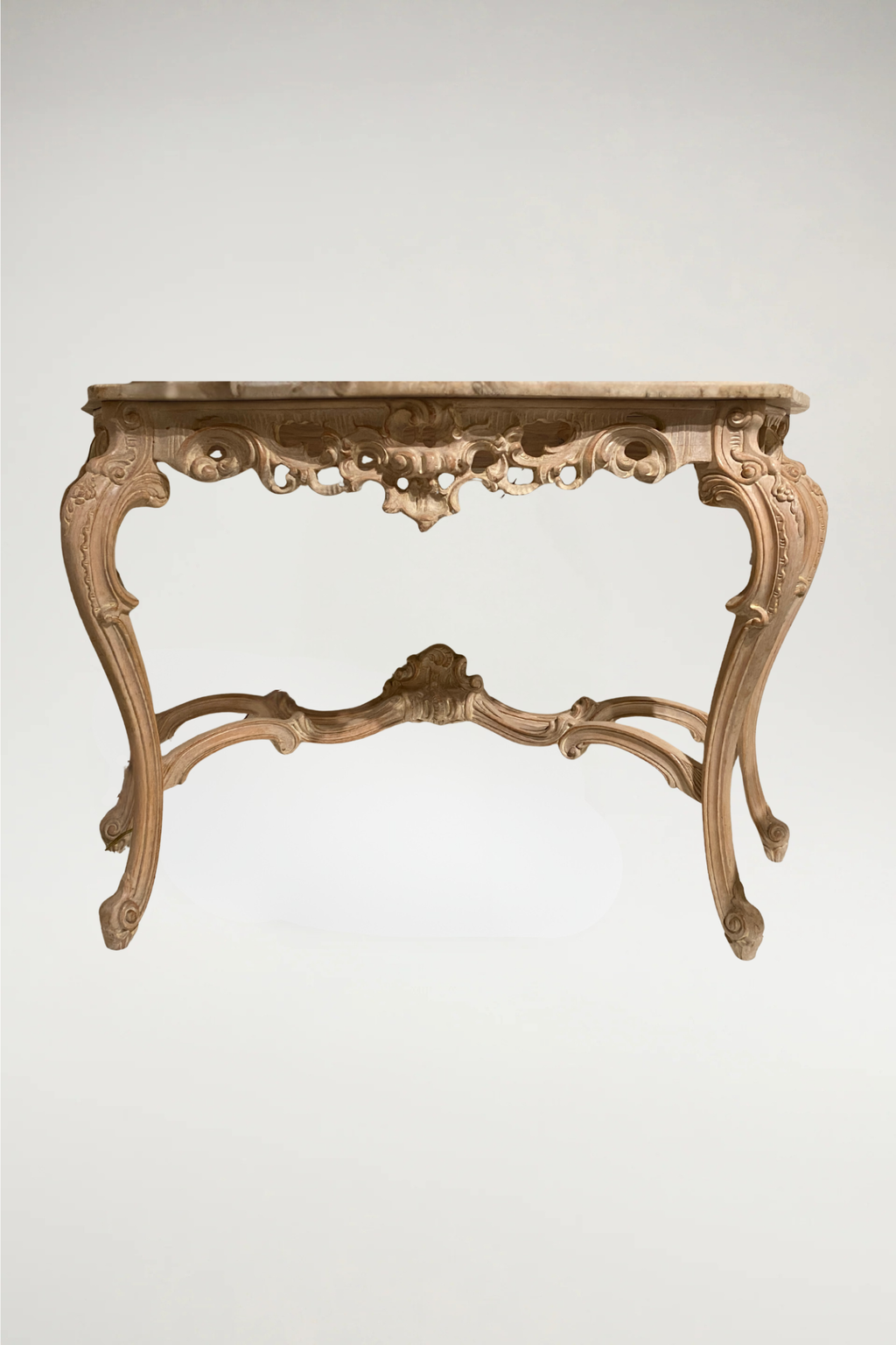 Ornately carved wooden base with ivory/grey/gold finish and honed white with grey marble top. This console will add a French Rococo flair to your decor.