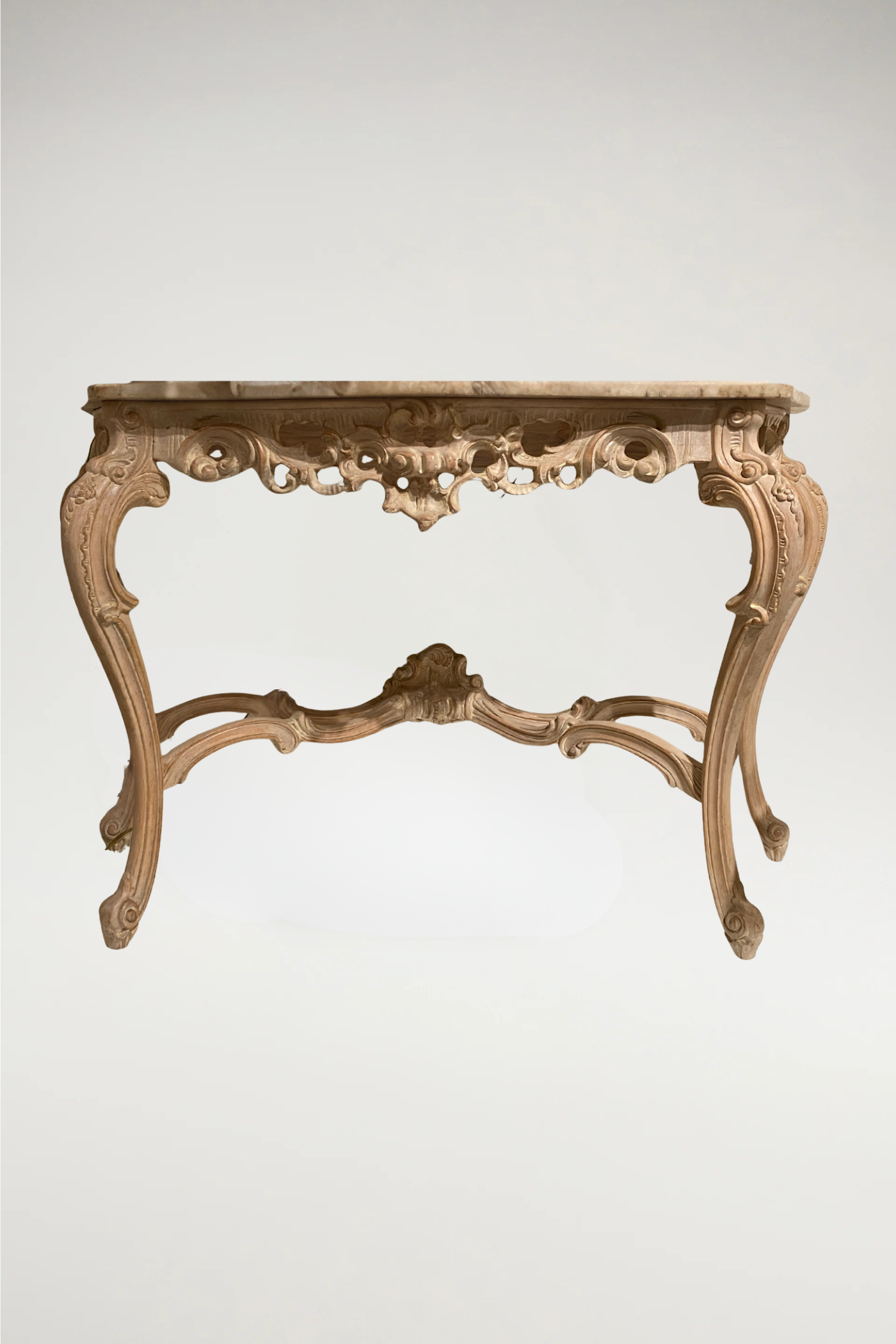 Ornately carved wooden base with ivory/grey/gold finish and honed white with grey marble top. This console will add a French Rococo flair to your decor.