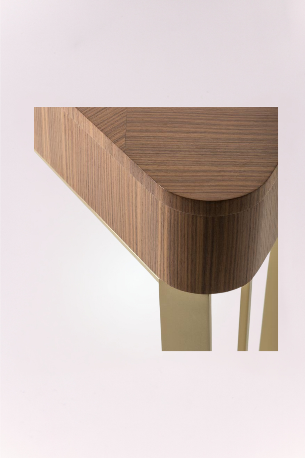 Wooden side table with a curved design on a light pink background