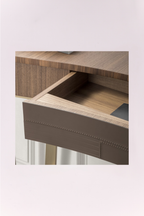 Wooden drawer with a visible grain pattern on a light background