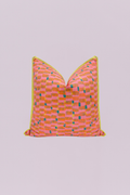 Inject vibrant energy into your room with this playful, contemporary accent pillow. The design features a dynamic, abstract block pattern in electric pink, bright orange, and teal, giving it a lively, hand-drawn look. A bold lime green piping frames the edge, making this piece a stunning, modern focal point for any decor.
