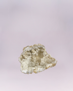 A mesmerizing natural wonder! This stunning geode fragment features a cave-like center lined with countless tiny, sparkling white and translucent quartz crystals, reminiscent of a frosty cavern. The rough, earthy stone shell provides a beautiful contrast to the bright, dazzling interior. Perfect for adding a touch of natural elegance and shimmer to any collection or display.