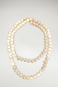A classic reimagined, The Lana is a versatile extra-long strand of creamy white pearls. Designed to be worn as one long, graceful sweep or doubled for a layered look, it features a sophisticated gold clasp that adds a touch of warmth to the traditional white luster.